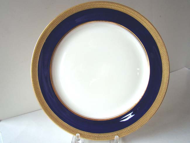 A fine set of 12 bone china 8 1/4" dessert plates with gilt decoration made by Lenox for TIFFANY & CO., c. 1920-1950.